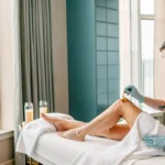 Arm and leg waxing in Tampa by a professional esthetician applying wax to a client's skin.